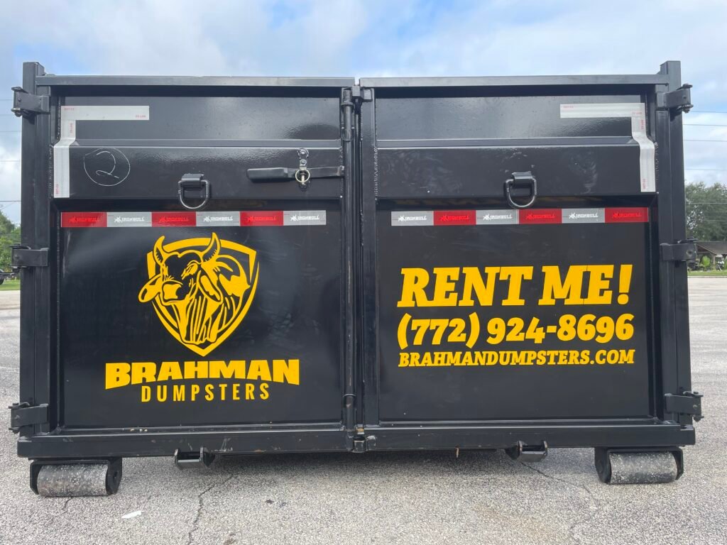 Dumpster Wrapped with Rent Me in Large Letters from a Back View.
